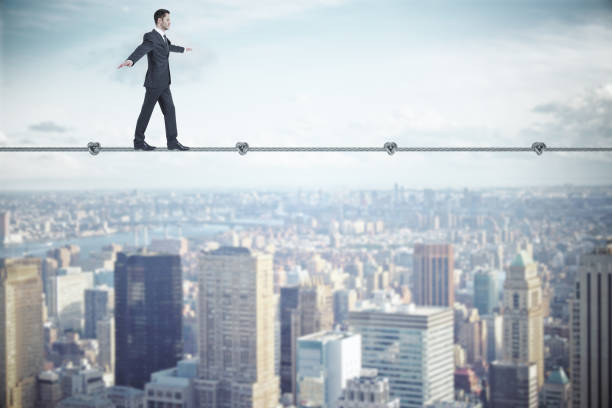 istock Businessman walking on rope 1222860500