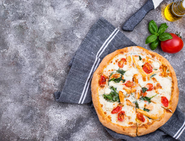 istock Italian pizza with tomato, mozzarella and chicken 1222863111