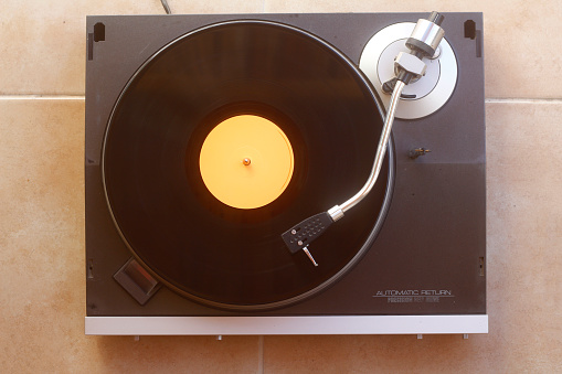 old vinyl record with clipping path. DJ Turntable with Vinyl Record, Playing, Top View