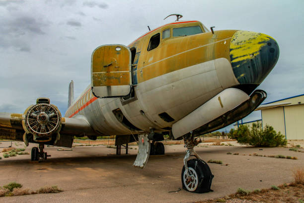 Abandoned airplane graveyard in Chandler, Arizona desert called the Gila River Memorial Airport Ruins of yellow and white airplane in abandoned airport chandler arizona stock pictures, royalty-free photos & images
