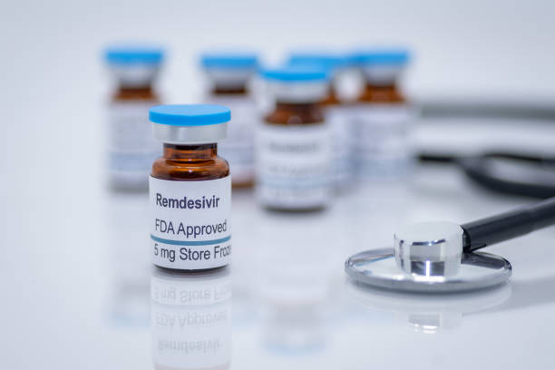 抗ウイルス薬レメディビルfdaは、新しいコロナウイルスcovid-19の治療のために承認 - vial capsule pill nobody ストックフォトと画像
