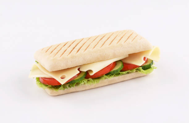 istock panini sandwich emmental cheese with salad, tomato , lettuce isolated on white background 1222865031