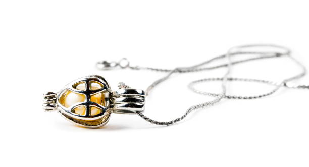 istock Silver pendant closeup on the white background 1222865399