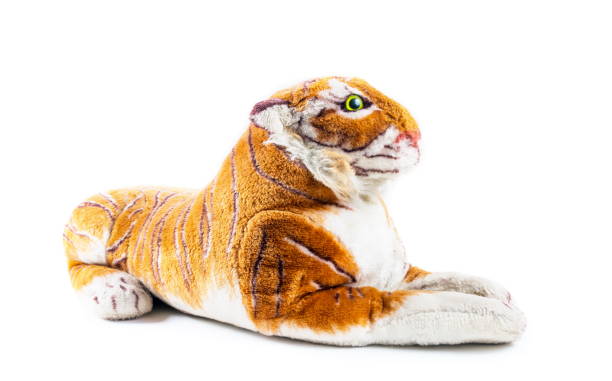 istock Tiger toy sitting on the white 1222866459