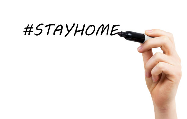 istock Marker in the hand says stay at home 1222866496