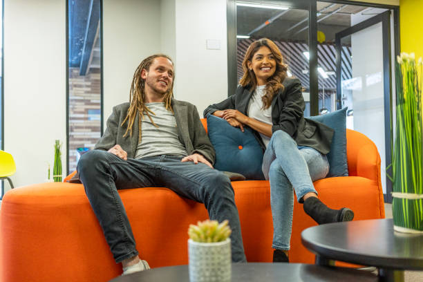 istock Two coworkers in their coworking space talking 1222870763