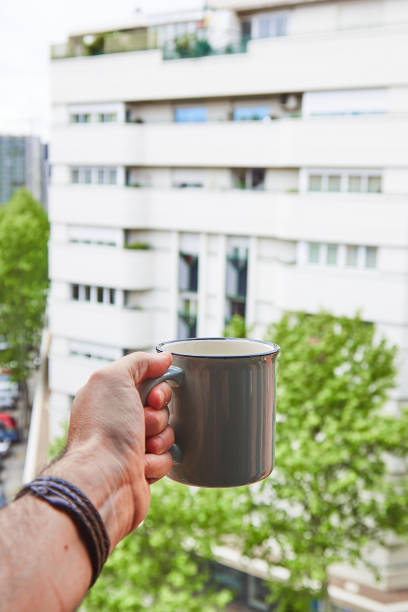 istock Boy celebrates his neighbors birthday with a coffee over confinement 1222870976