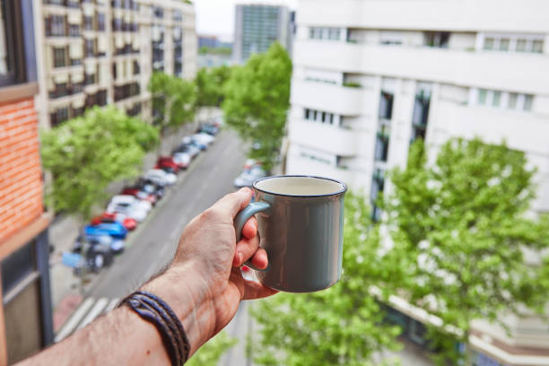 istock Boy celebrates his neighbors birthday with a coffee over confinement 1222870981