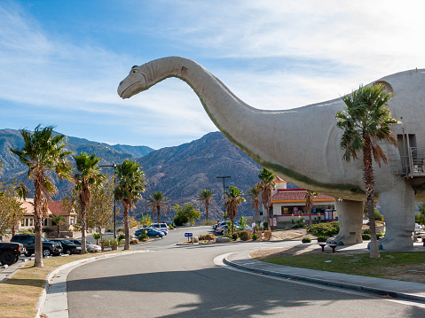 Cabazon, CA USA - A rear view of Ms Dinny, the Brontosaurus Gift Shop at the roadside attraction off interstate 10 highway known as Claude Belle's Dinosaurs.