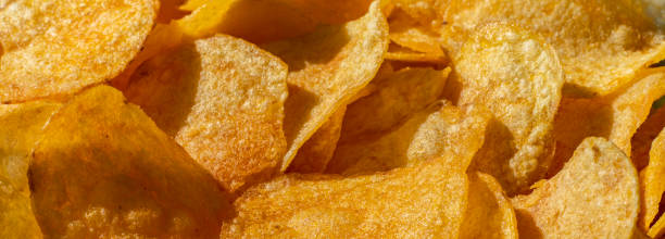 istock macro view of the yellow  potato chips background pattern 1222872482