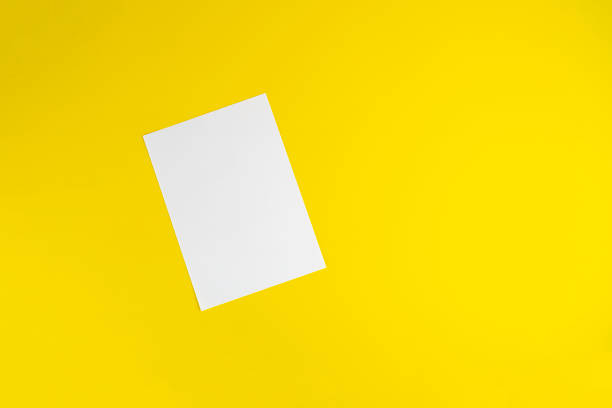 istock blank empty white paper sheet of a4 format on the table in office, mockup copy space 1222872592