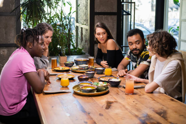istock Multi-ethnic students meeting in an asian style cafe 1222872848