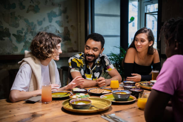 istock Multi-ethnic group of friends spending time in a cafe, chatting 1222872881