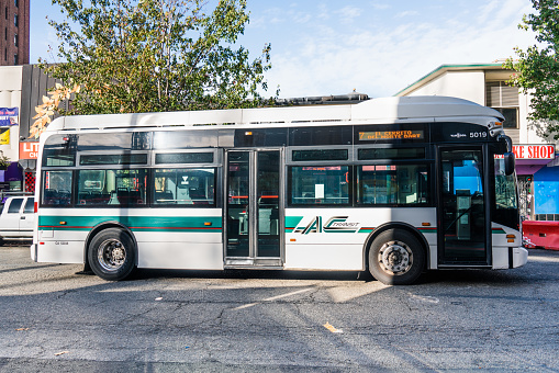 Oct 18, 2019 Berkeley / CA / USA - Side view of an AC Transit bus; AC Transit is a public transit agency serving the western portions of Alameda and Contra Costa counties in East San Francisco Bay