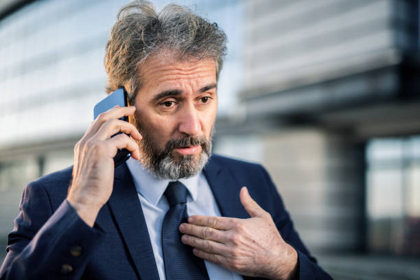 istock Serious mature business man having a strict phone discussion. 1222876474