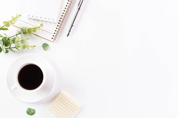 istock Flat lay, top view office table desk. Workspace with keyboard, office supplies, pencil and coffee cup with copy space on white background. 1222879078
