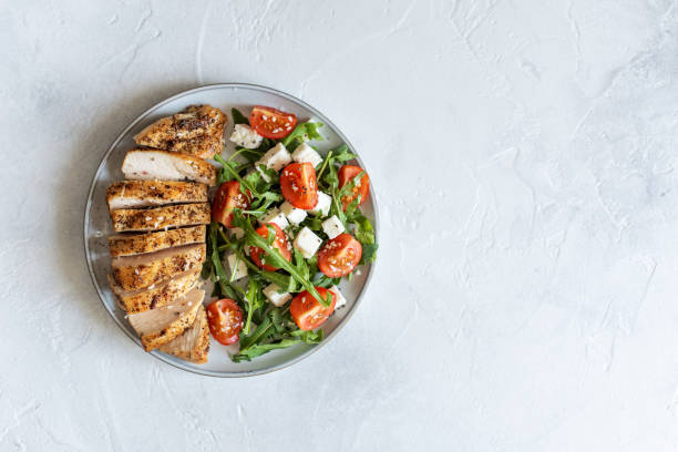 istock Close-up on a salad with chicken and tomato 1222879690