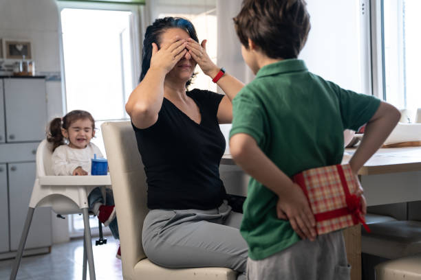 istock Son Giving His Mother Mother's Day Gift 1222880544