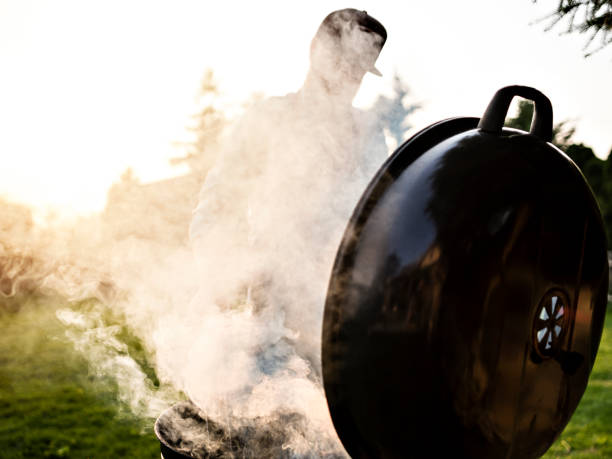 istock Unrecognisable man cooks meat outdoor. 1222881265