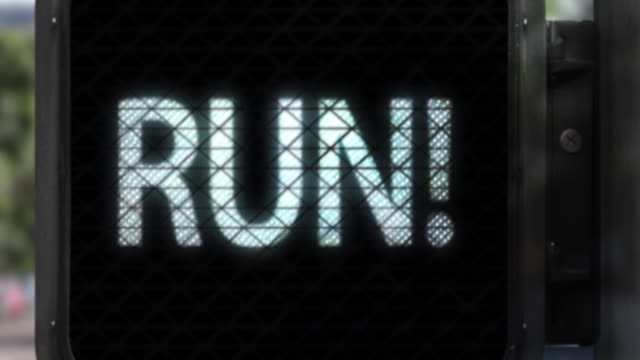 Don't Walk. Run!—Closeup of Walk Signal with fun phrase in white letters