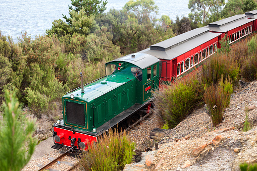 Strahan, Tasmania, Australia, December 4, 2013:Locomotive and carriages on the  West Coast Wilderness Railway running between Queenstown and Strahan using the Abt rack system to conquer the mountainous terrain through rainforest