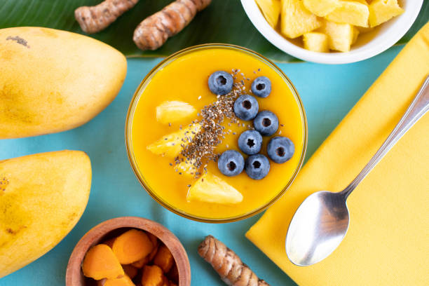 istock Mango turmeric smoothie bowl with blueberries, pineapple and chia seeds 1222882274