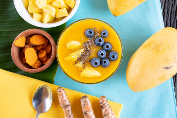 istock Mango turmeric smoothie bowl with blueberries, pineapple and chia seeds 1222882275