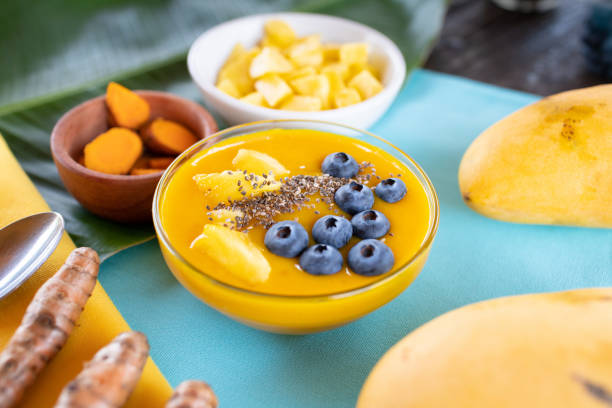 istock Mango turmeric smoothie bowl with blueberries, pineapple and chia seeds 1222882305