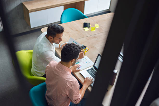 istock colleagues are working at the company desk so they work 1222889703