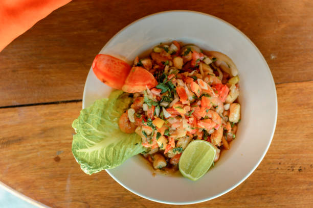 istock Ceviche closeup on a wooden table, top view. 1222890656