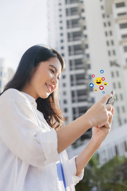 istock Young woman using a smartphone with social media concept 1222890658