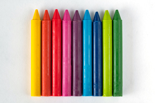 Crayons and pastels isolated on white background with copy space. Education learning art concept.