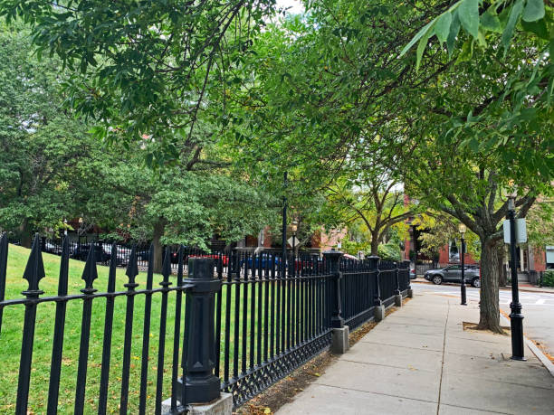 istock Black Park Fence and Sidewalk 1222898697