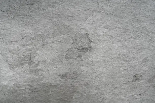 Photo of Grey black slate stone background or texture