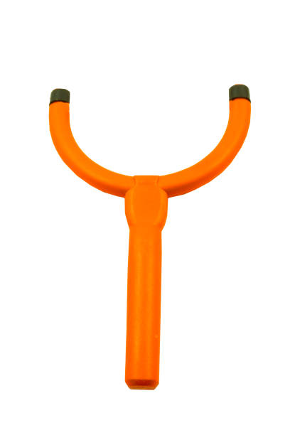 Extended slingshot with a rock in it isolated on white bakground