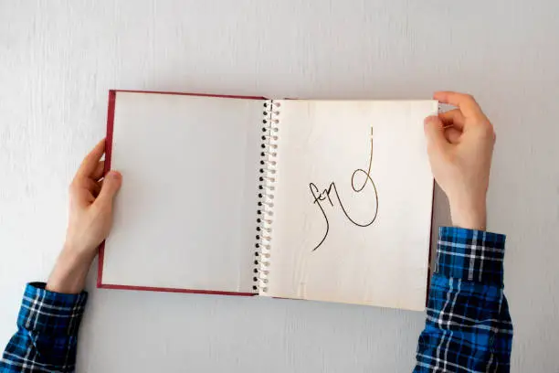 Photo of author sign the autograph of his new novel book to the fan reader, popularity concept