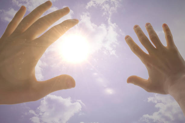 istock human hand cover himself from the sun light strike from the sky, first person view 1222906197