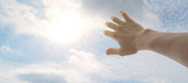 istock human hand cover himself from the sun light strike from the sky, first person view 1222906200