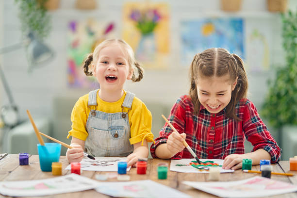 istock Happy kid is painting at home. 1222906599