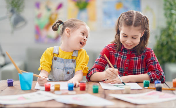 istock Happy kid is painting at home. 1222906639