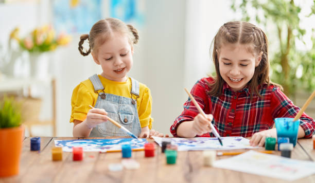 istock Happy kid is painting at home. 1222907187