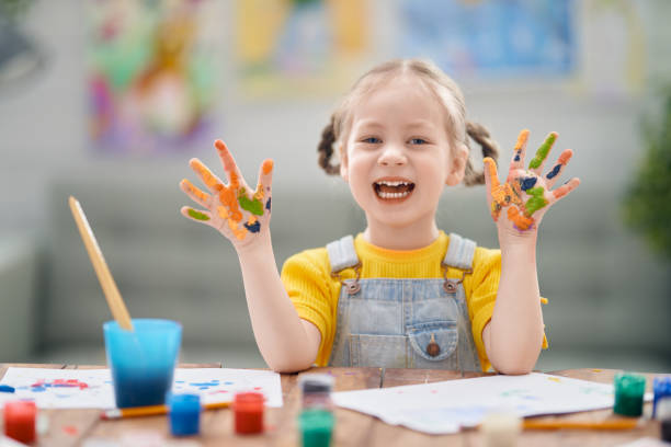istock kid is painting at home 1222907197
