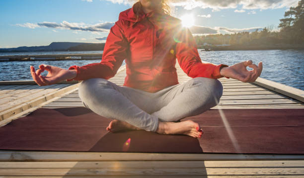 istock Close up of unknown female doing yoga. 1222907486