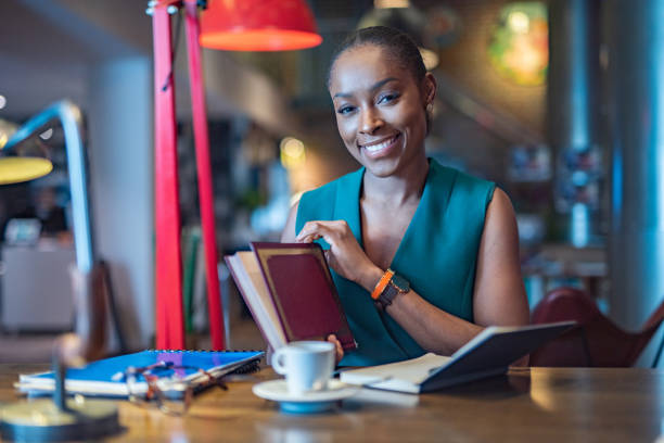 istock Happy businesswoman reading a book. 1222908779