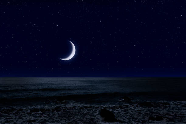 istock Crescent moon rising over the sea. 1222909531