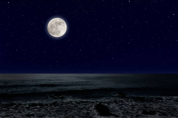 istock Full moon rising over the sea. 1222909532