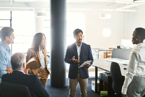 istock Businessman discussing with colleagues in meeting 1222911493