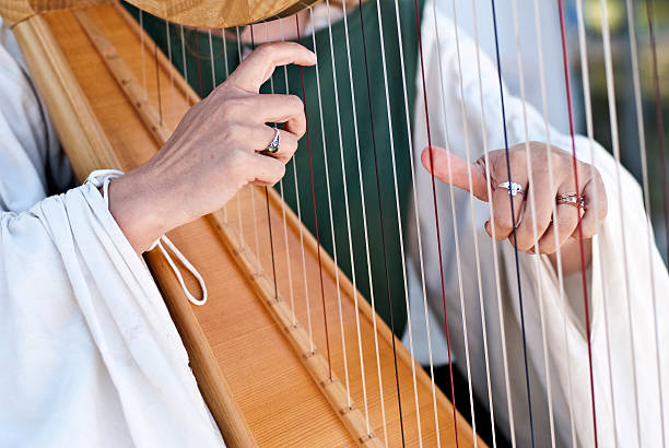 istock Woman playing the harp 122291230