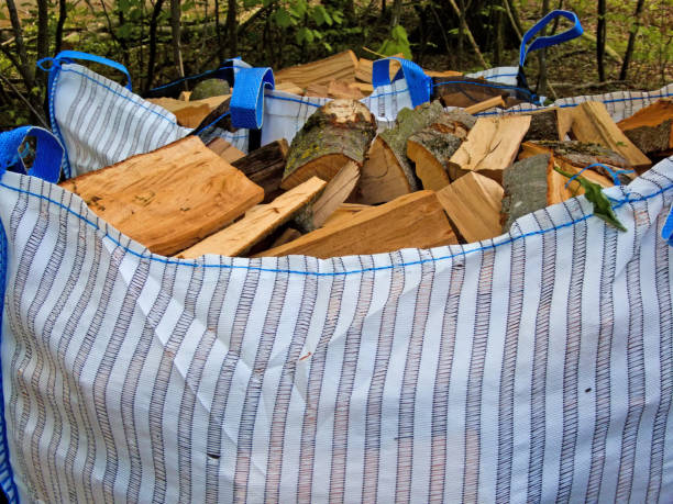 freshly chopped fuel-wood in a bag in a forest freshly chopped fuel-wood in a bag in a forest fuelwood stock pictures, royalty-free photos & images