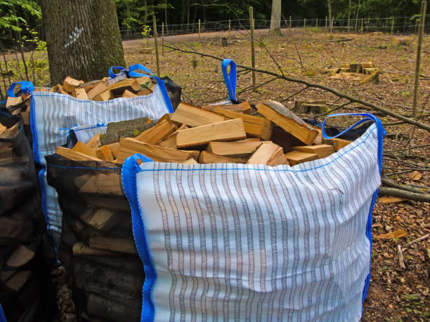 freshly chopped fuel-wood in a bag in a forest freshly chopped fuel-wood in a bag in a forest fuelwood stock pictures, royalty-free photos & images